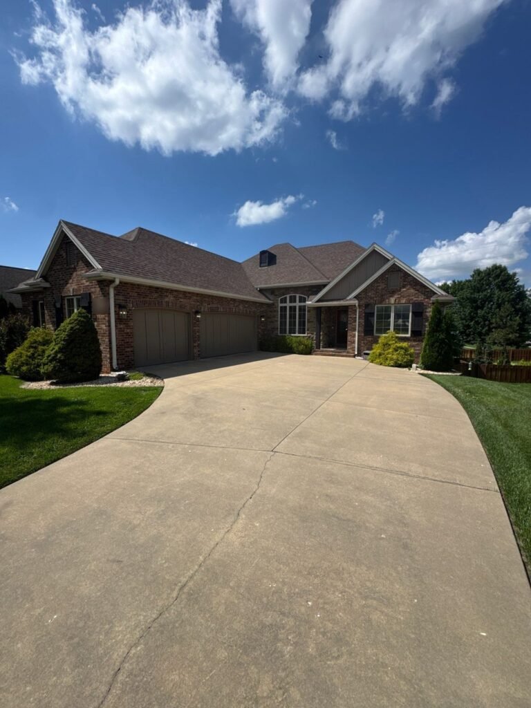Nixa, MO home with its original weathered wood shingle roof before replacement