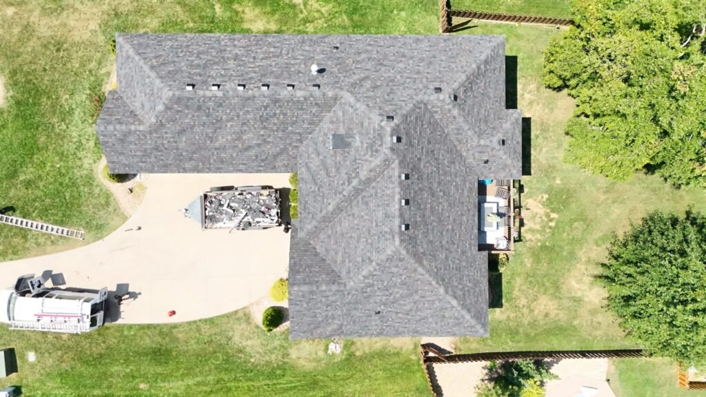 Top-down drone view of a finished Owens Corning roof replacement in Nixa, MO