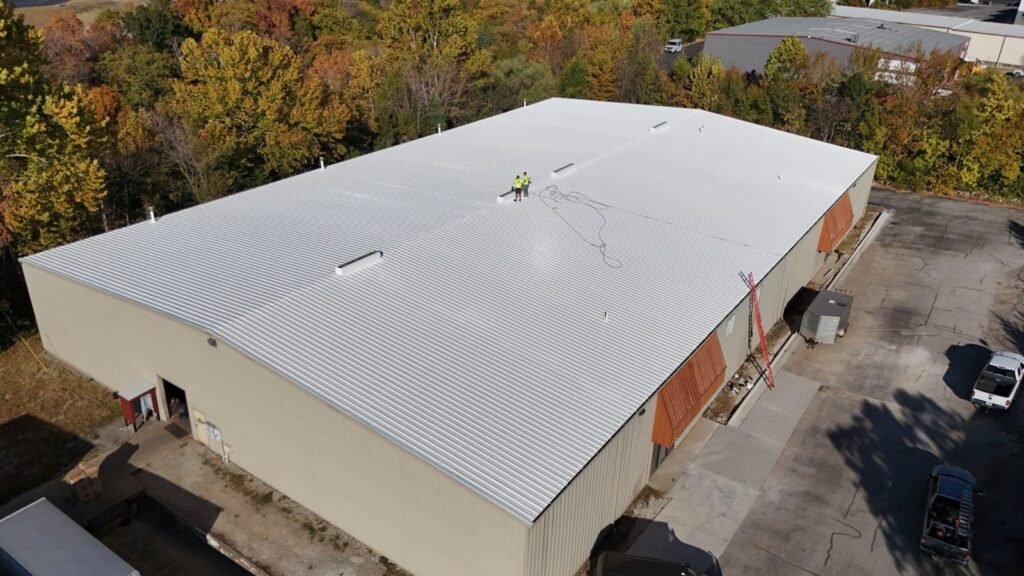 Reflective white roof coating on an industrial warehouse in Hollister, Missouri