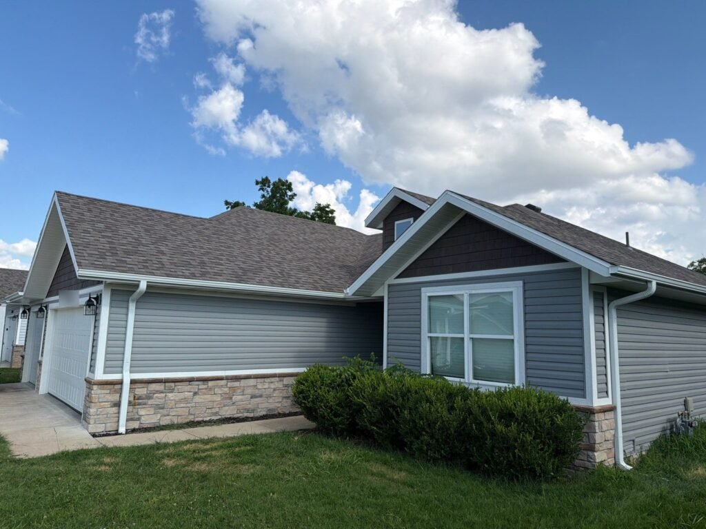 Finished roof, seamless gutters and vinyl siding on a northwest Springfield, MO home after the April 2026 hailstorm